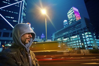 Man in a hood outdoors view clipart