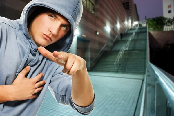Young handsome men in a hood outdoors — Stock Photo, Image