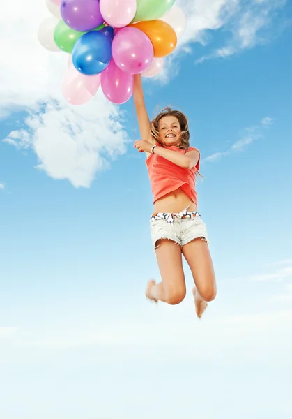 Дівчина з різнокольоровими кульками — стокове фото