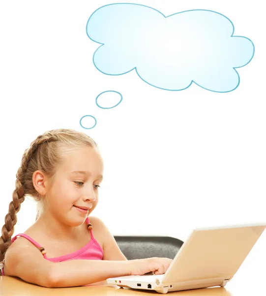 Little schoolgirl with a laptop — Stock Photo, Image