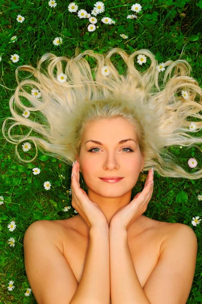 Woman relaxing on a meadow — Stock Photo, Image
