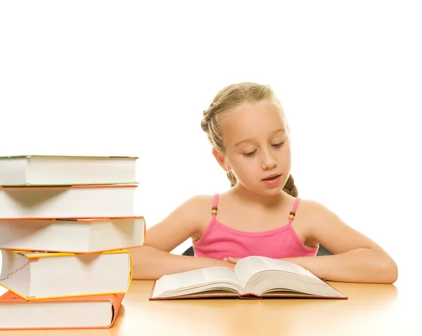 Young schoolgirl reading a book — Stock Photo, Image
