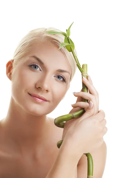 Woman with a bamboo plant — Stock Photo, Image
