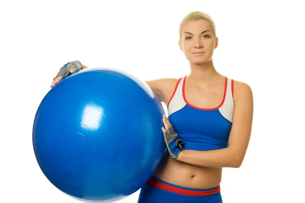 Woman trainer holding fitness ball — Stock Photo, Image