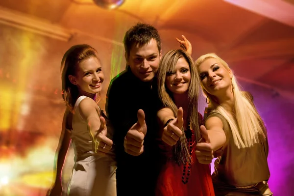 Happy friends in the night club Royalty Free Stock Photos