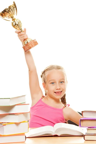 Happy schoolgirl with a golden cup — Stock Photo, Image