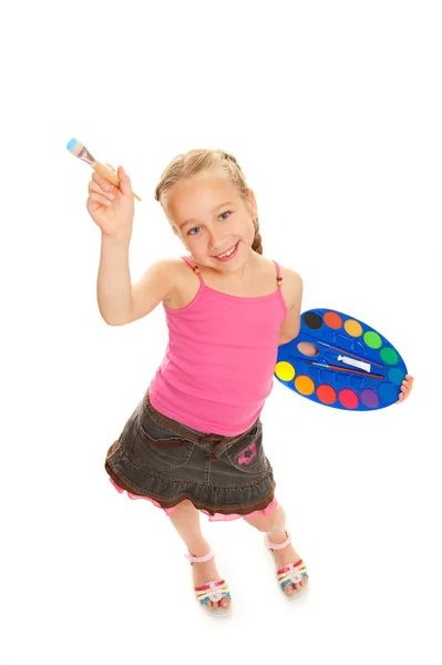 Beautiful little girl with a paintbrush — Stock Photo, Image