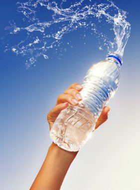 Human hand holding a bottle of water clipart