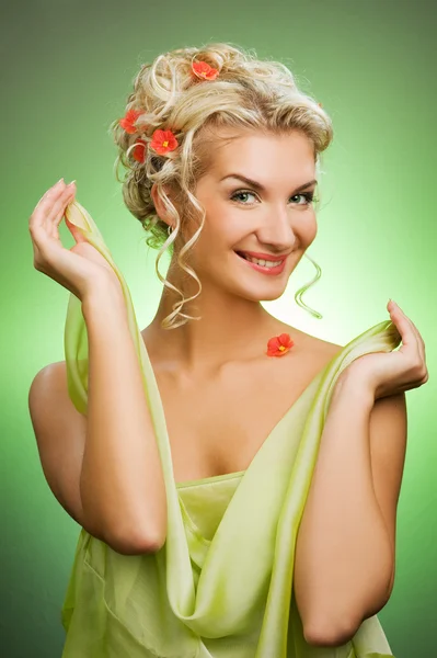 Young woman with fresh spring flowers — Stock Photo, Image