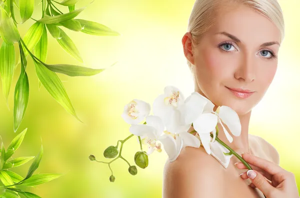 Beautiful woman with orchid flower Stock Photo