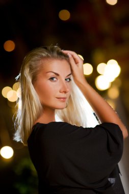 Young blond woman outdoors clipart