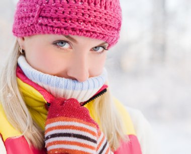 Frozen woman in winter clothing clipart