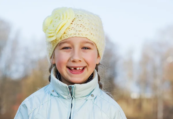 Happy toothless girl outdoors — Stock Photo, Image