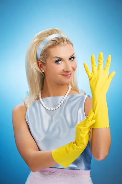 Happy housewife with rubber gloves — Stock Photo, Image