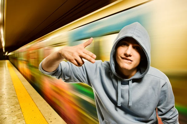Young criminal in subway — Stock Photo, Image