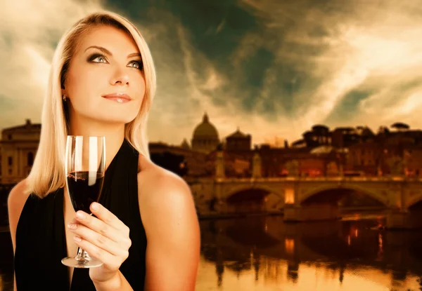 Woman drinking wine near the river — Stock Photo, Image