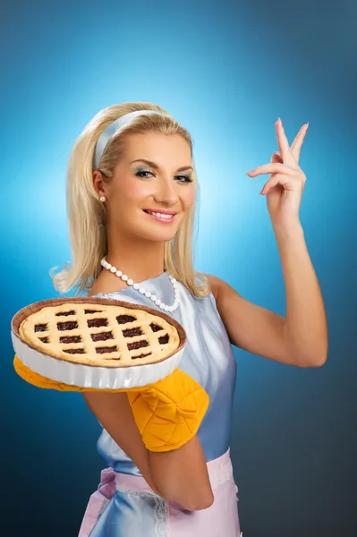Beautiful woman holding hot italian pie — Stock Photo, Image