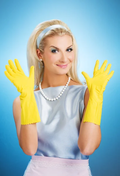 Happy housewife with rubber gloves — Stock Photo, Image