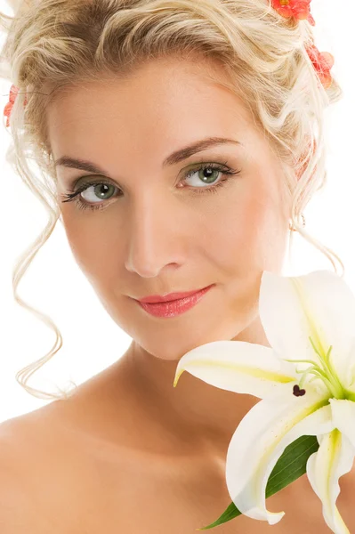 Beautiful young woman with lily flower — Stock Photo, Image