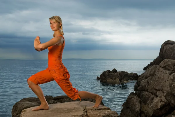 Beautiful woman doing yoga exercise — Stock Photo, Image