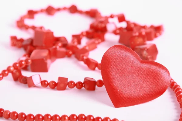 Heart and beads on white — Stock Photo, Image
