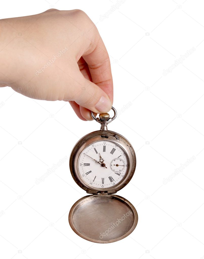 Hand holds silver pocket watch