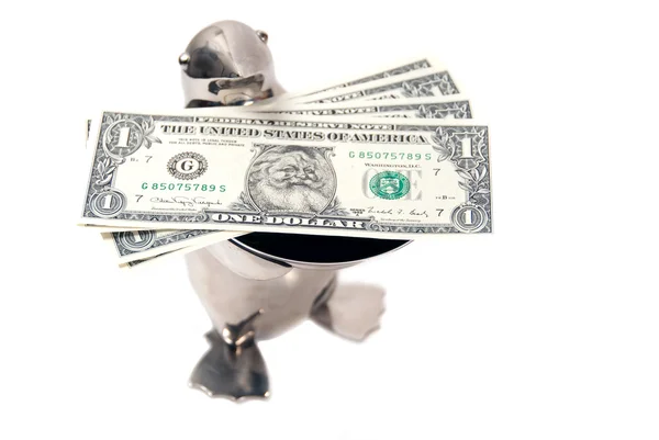 Penguin offering real santa dollars Stock Picture