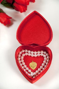 Open heart shaped box with pearls and ne clipart