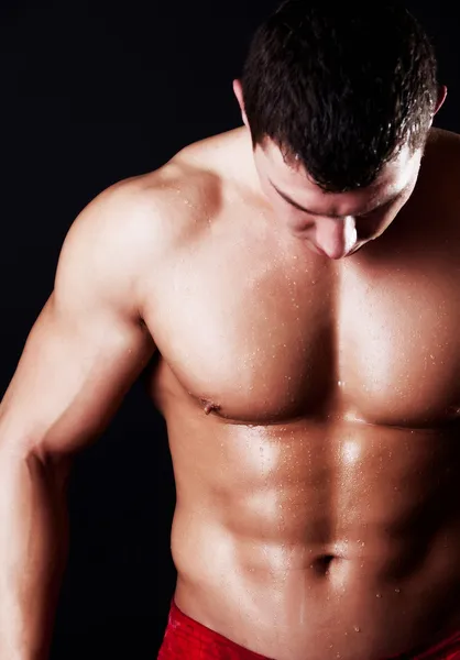 Atleta mostrando sus músculos abdominales —  Fotos de Stock
