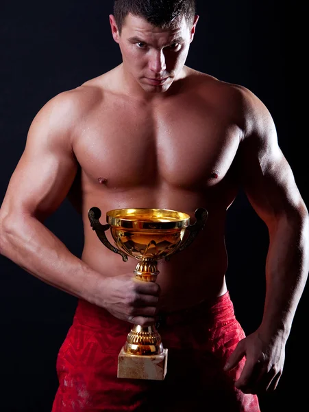 Bild des Athleten mit seiner Tasse — Stockfoto