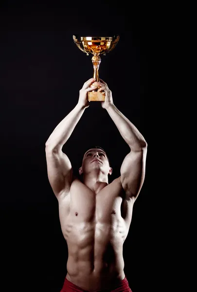 Champion lyfta hans cup — Stockfoto