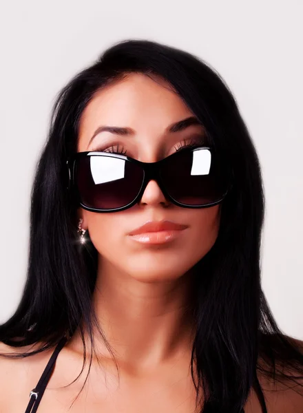 Vrouw met zonnebril Stockfoto
