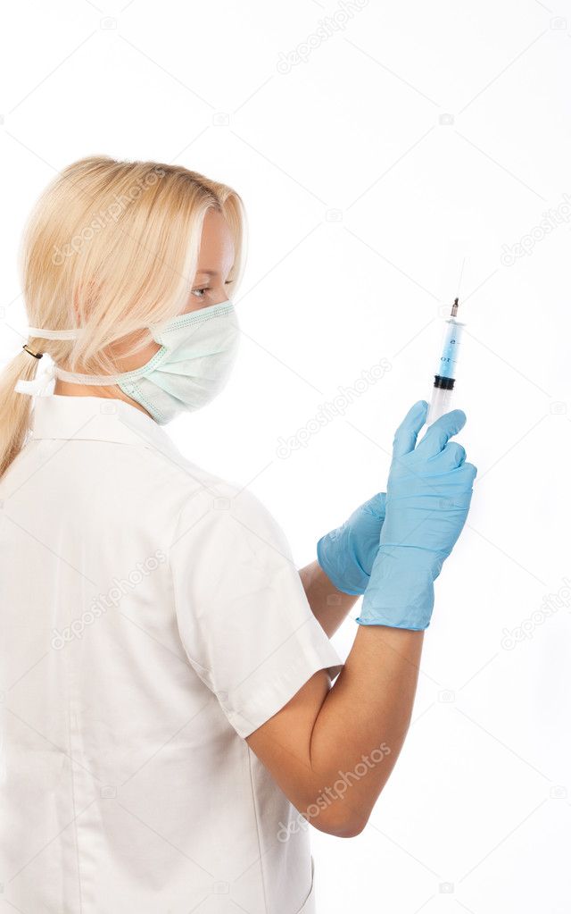 Nurse with medical syringe