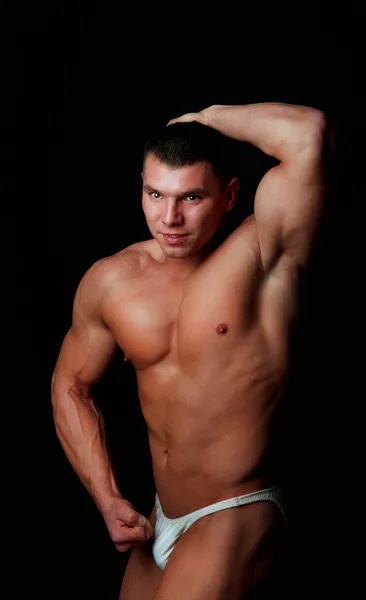 Hombre mostrando sus músculos — Foto de Stock