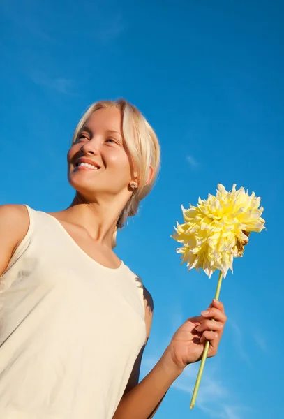 Portrait of happy young girl with dahlia — Stock Photo, Image