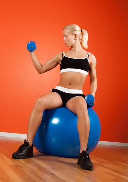 Attractive blonde sitting on ball — Stock Photo, Image