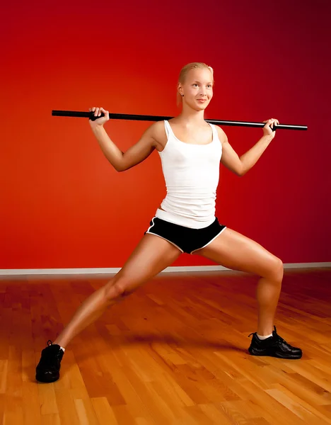 Muscular blonde with fitness stick — Stock Photo, Image