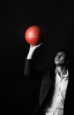 Young man holding basketball ball clipart