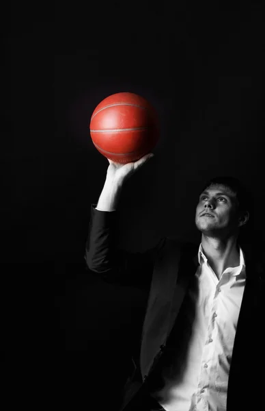 Young man holding basketball ball — Stock Photo, Image