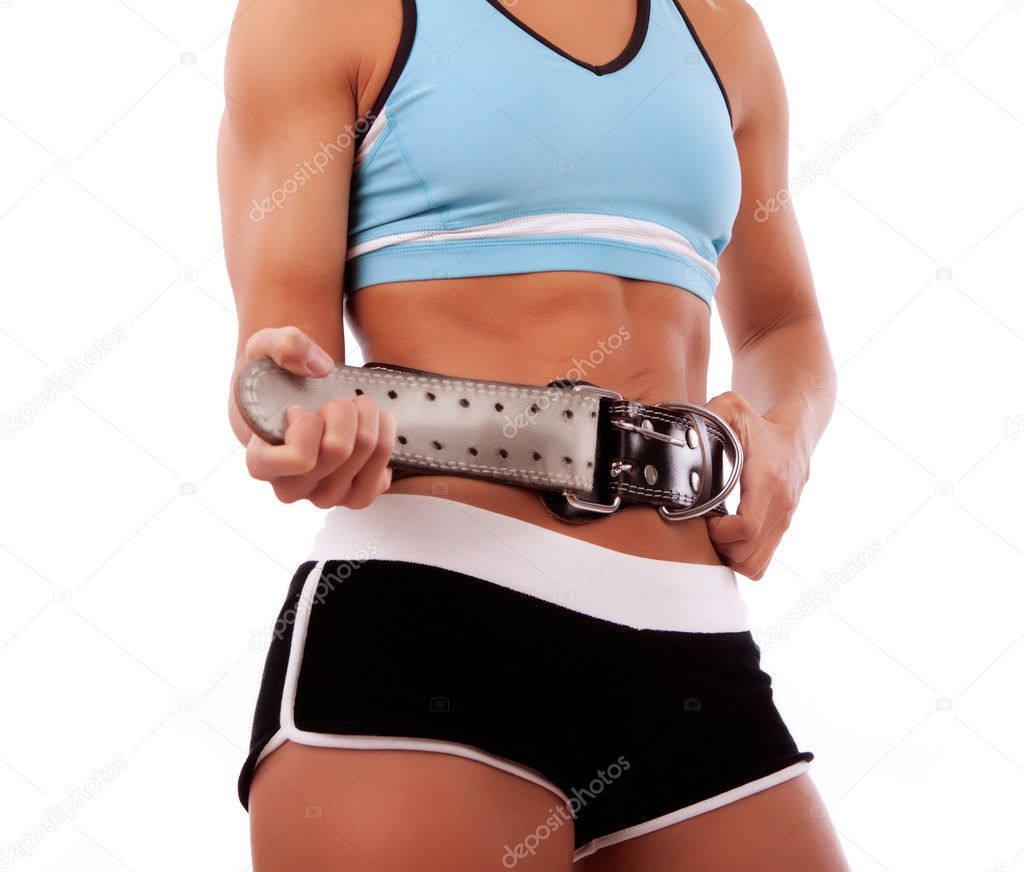 Sportswoman fastening her belt