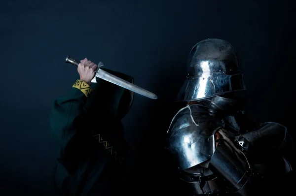 Assassin trying to kill the glory knight — Stock Photo, Image