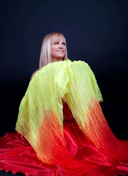 Sexy woman holding colour cloak — Stock Photo, Image