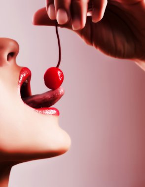 Woman tasting a cherry clipart