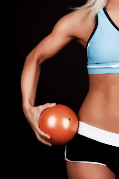Fitness ball in hands — Stock Photo, Image