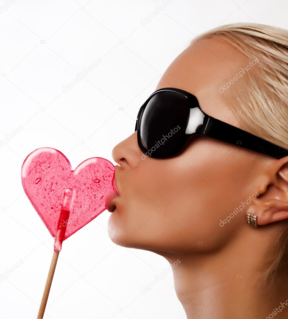 Sexy woman sucking lollipop