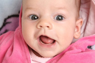 Closeup portrait of happy baby girl clipart