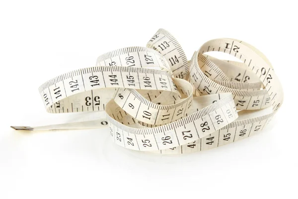 Curled white measuring tape — Stock Photo, Image