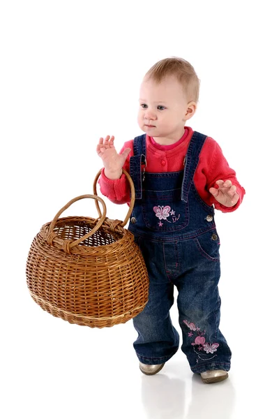 Little baby girl with a wattled basket — Stock Photo, Image