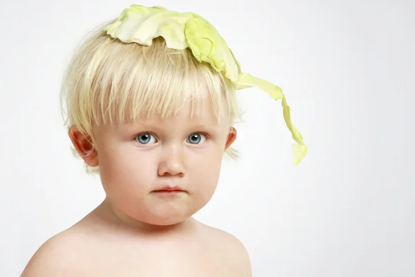 Boy with cabbage sheet (soft focus) — Stock Photo, Image