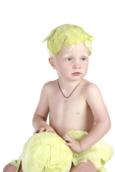 Child chewing cabbage (soft focus) — Stock Photo, Image